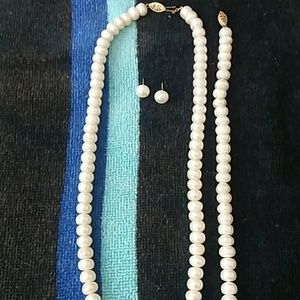 Pearl Necklace, bracelet, and earring studs.